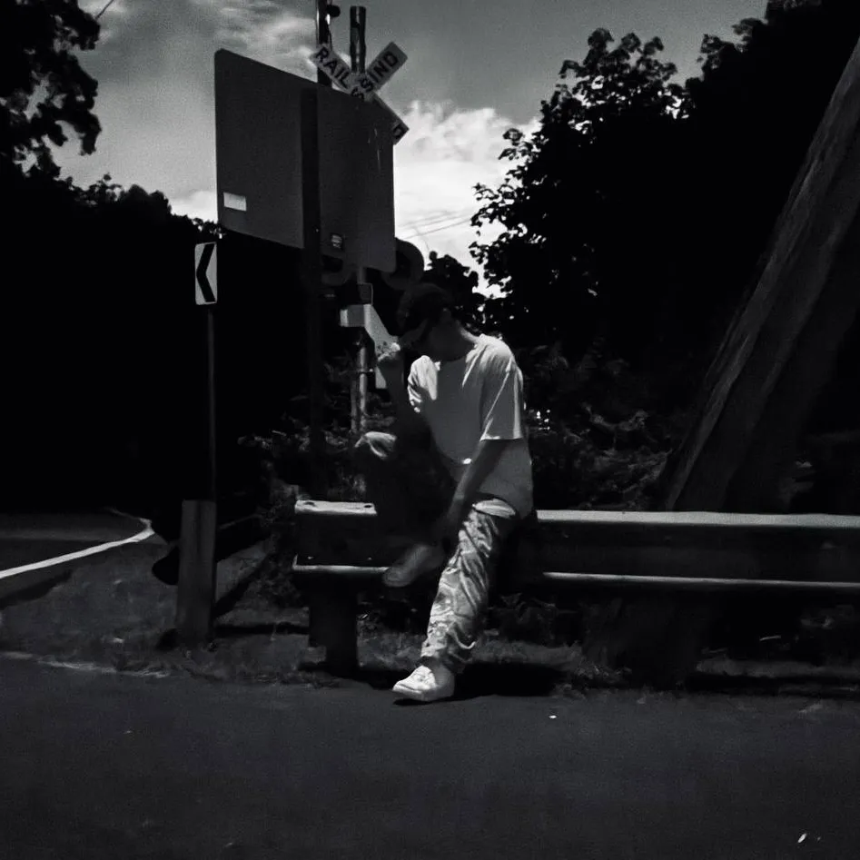 Jules posing at a railroad crossing.